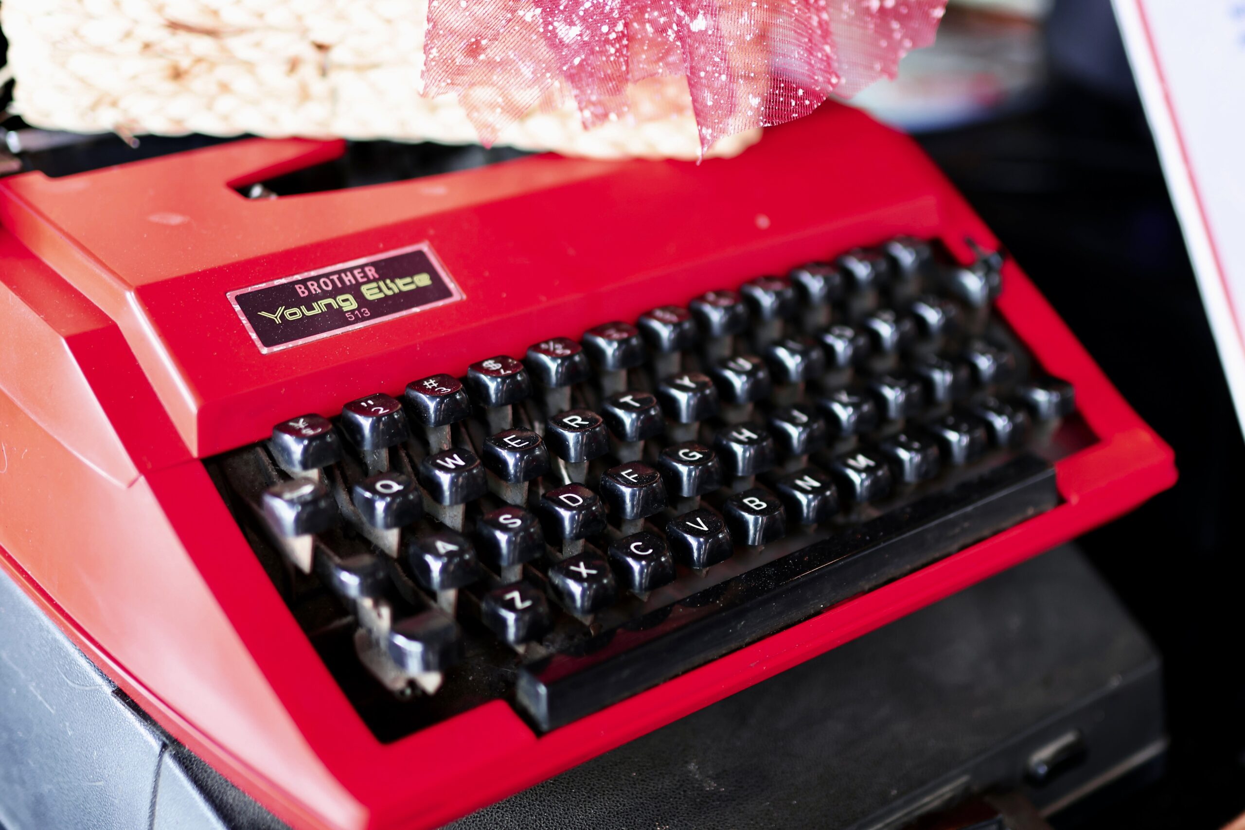 A photograph of a red Brother Young Elite typewriter.